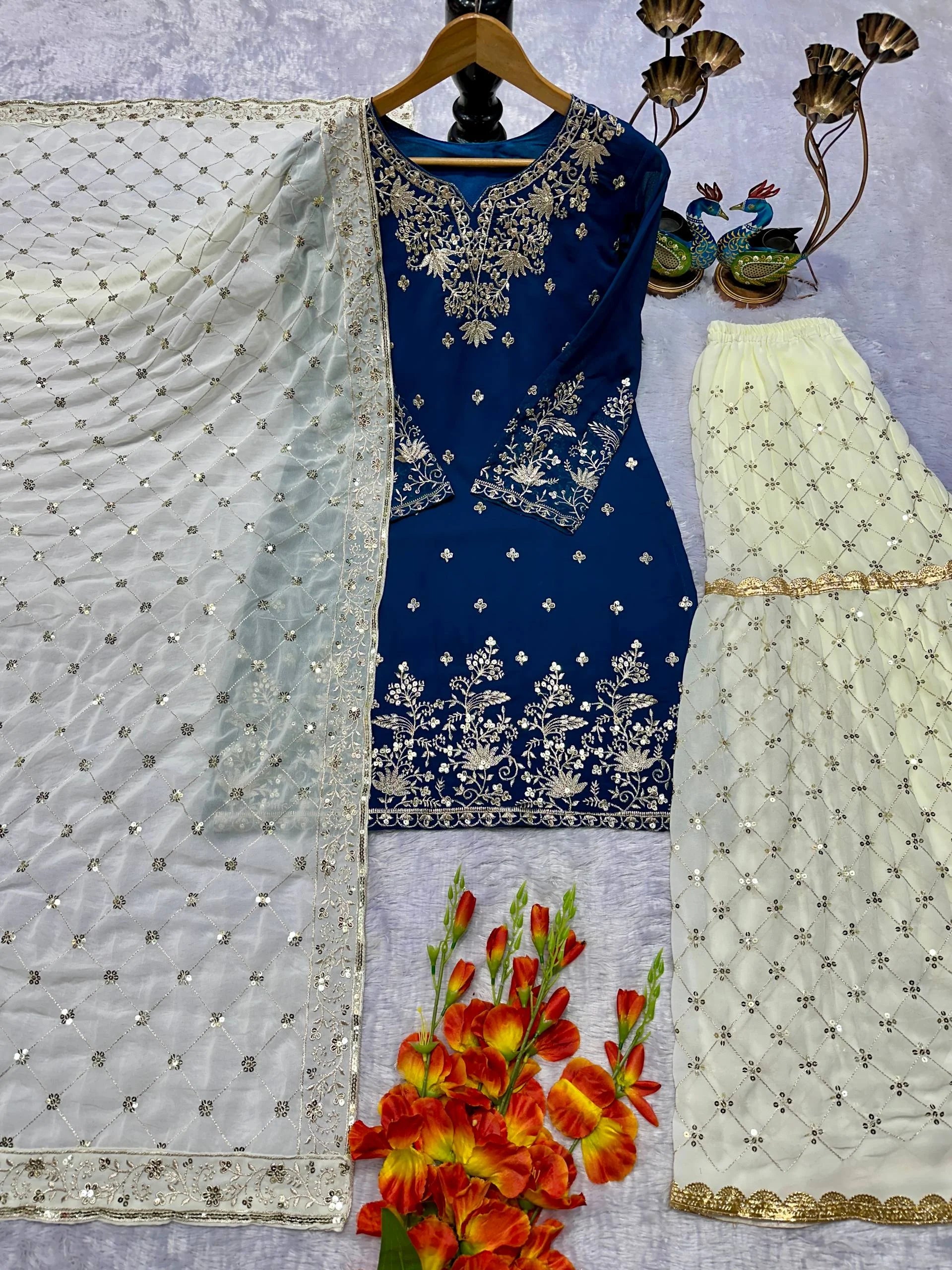 Graceful Blue Georgette Sharara and Top with Rich Lace Work Dupatta