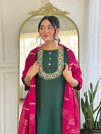 Bottle green glam with a vibrant rani pink dupatta touch