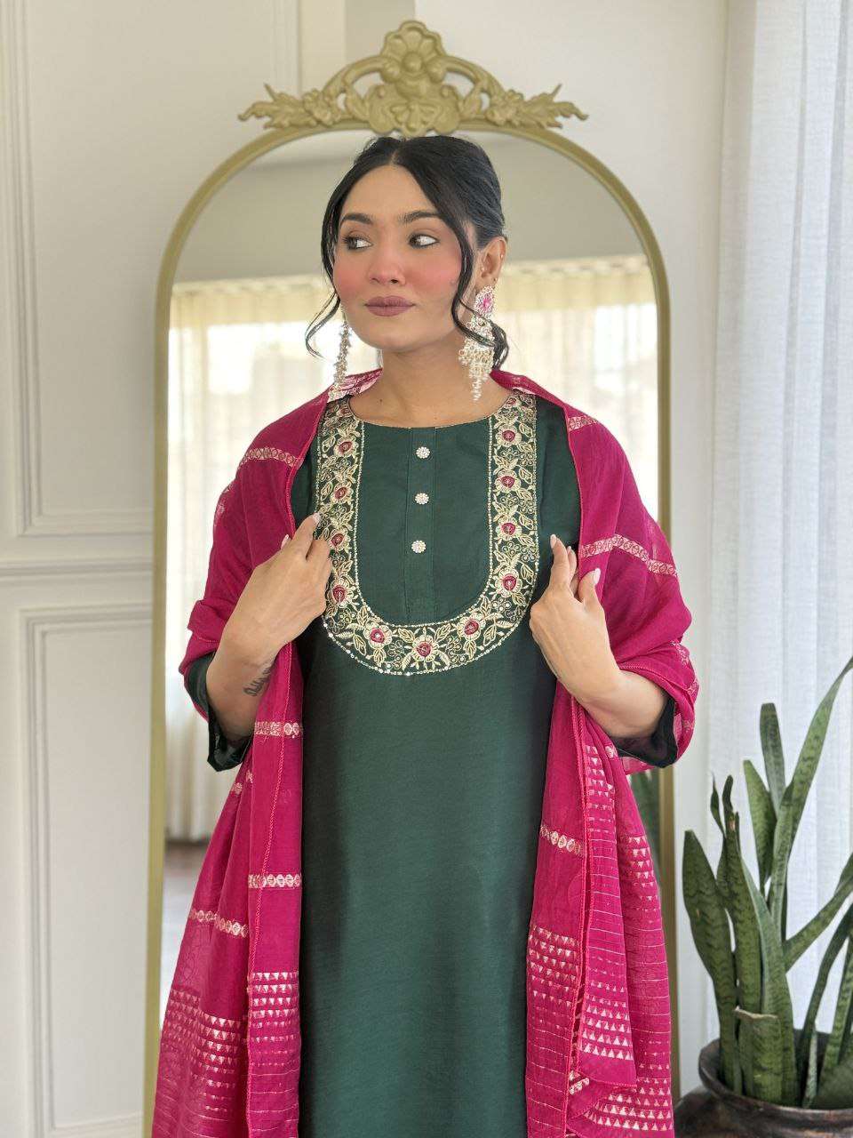 Bottle green glam with a vibrant rani pink dupatta touch