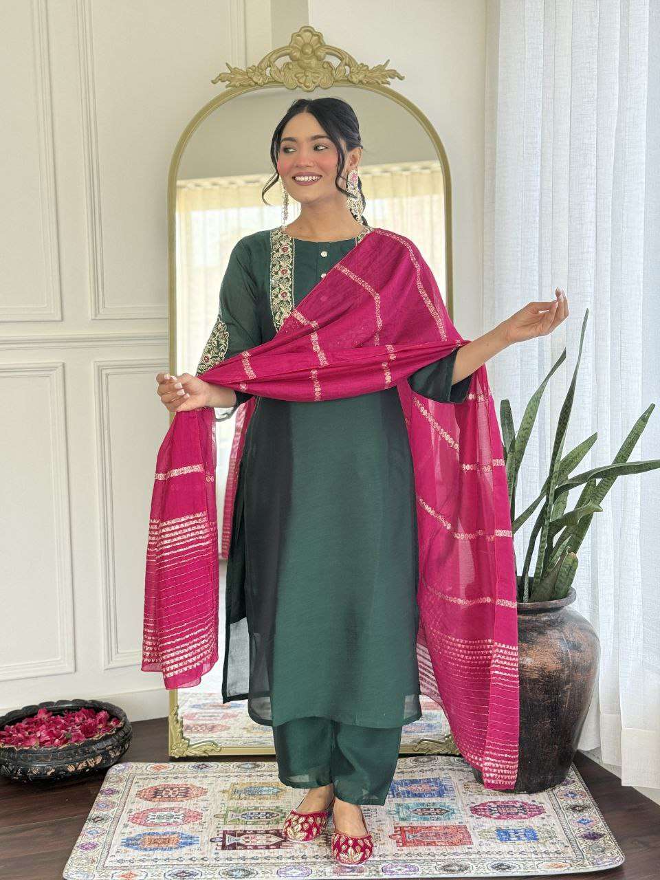 Bottle green glam with a vibrant rani pink dupatta touch
