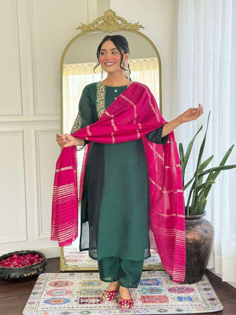 Bottle green glam with a vibrant rani pink dupatta touch