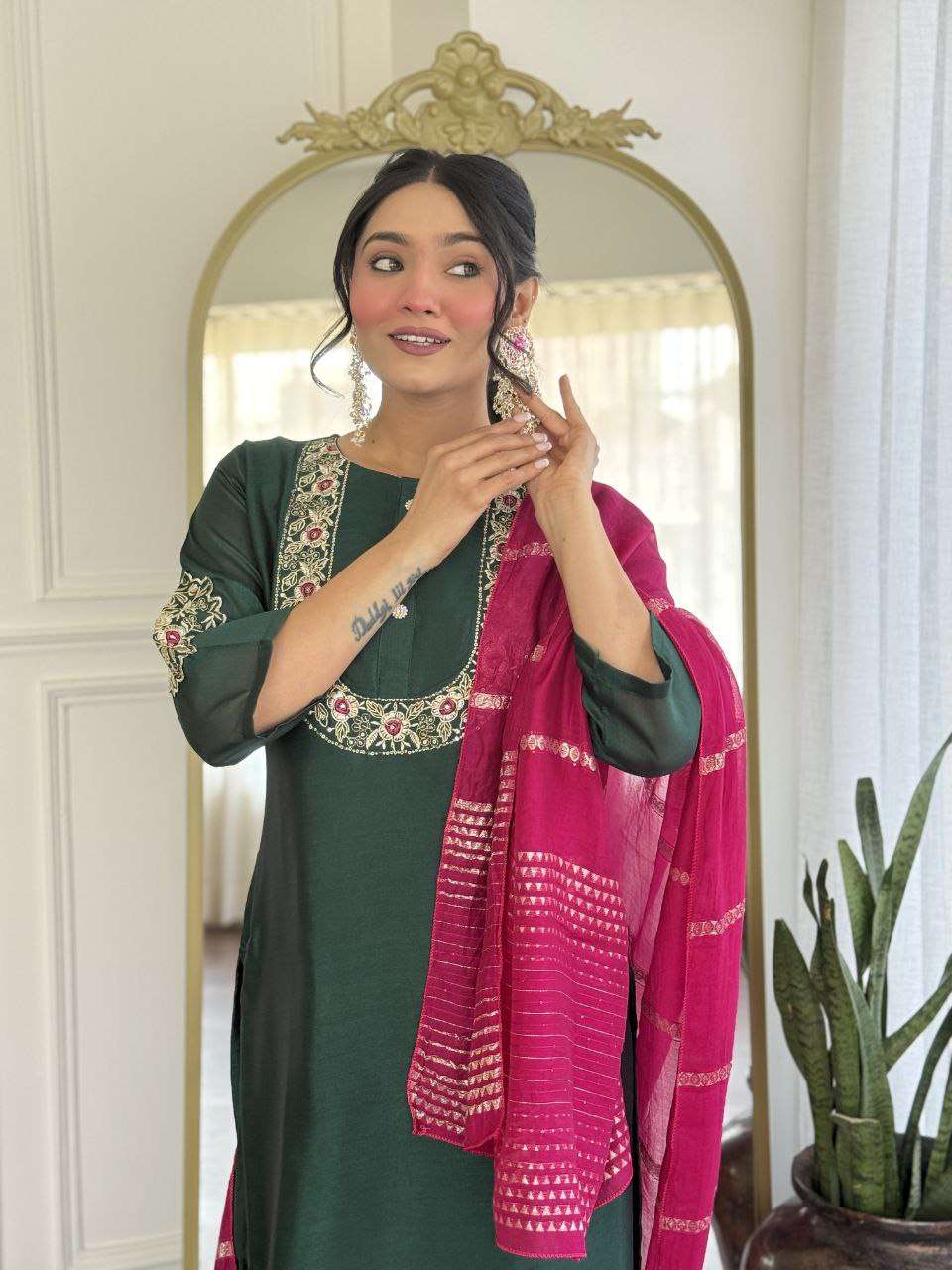 Bottle green glam with a vibrant rani pink dupatta touch