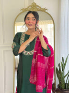 Bottle green glam with a vibrant rani pink dupatta touch
