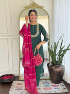 Bottle green glam with a vibrant rani pink dupatta touch