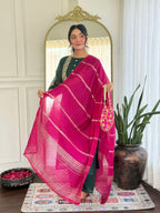 Bottle green glam with a vibrant rani pink dupatta touch