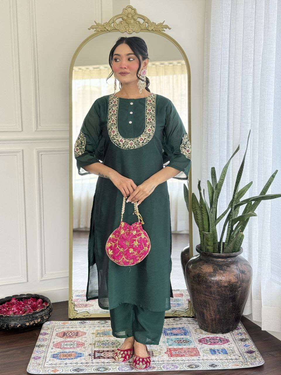 Bottle green glam with a vibrant rani pink dupatta touch