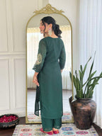 Bottle green glam with a vibrant rani pink dupatta touch